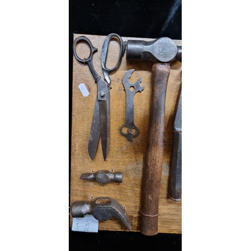 234 - A fabulous collection of vintage and antique tools including hammers, knifes, spoke shave, and other... 