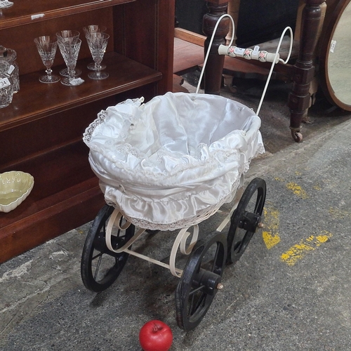 1123 - A charming vintage style toy pram, with wicker basket lined with satin and lace lining.
Previous in ... 