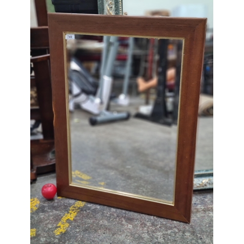 1124 - A solid wood and gilt framed beveled glass mirror.
Previous in auction on 05/09/2024 with Lot no.749