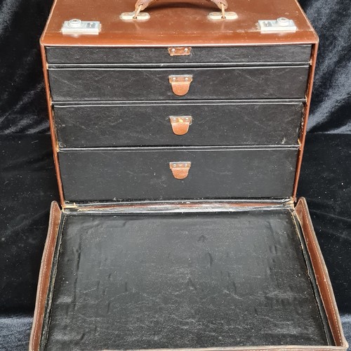 224 - A vintage leather travel doctor's medical box with four graduated drawers to interior with some vint... 