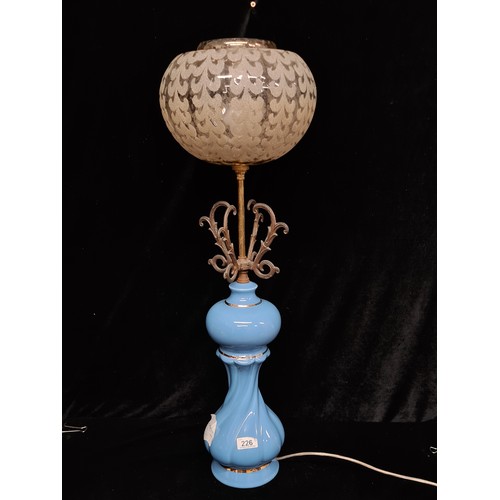 226 - A pair of 1970's retro table lamps with ice cream coloured ceramic bases and brass scrolled tops. Et... 