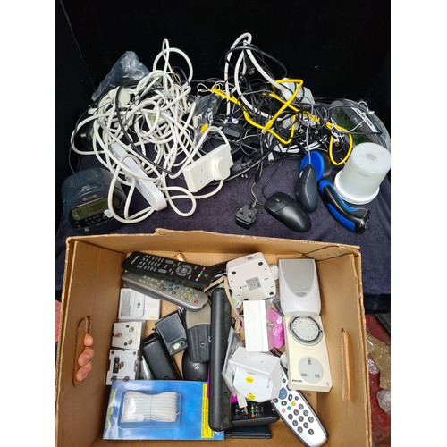 295 - A box containing various electronic items and accessories: a Philips digital clock, a Macally USB ch... 