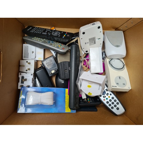 295 - A box containing various electronic items and accessories: a Philips digital clock, a Macally USB ch... 