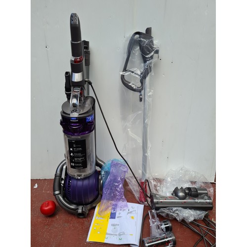 354 - An as new boxed, Dyson ball DC25 animal upright vacuum cleaner / hoover. With all attachments. RRP €... 