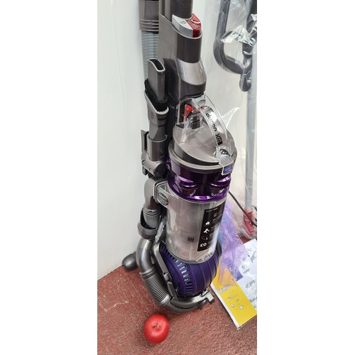 354 - An as new boxed, Dyson ball DC25 animal upright vacuum cleaner / hoover. With all attachments. RRP €... 