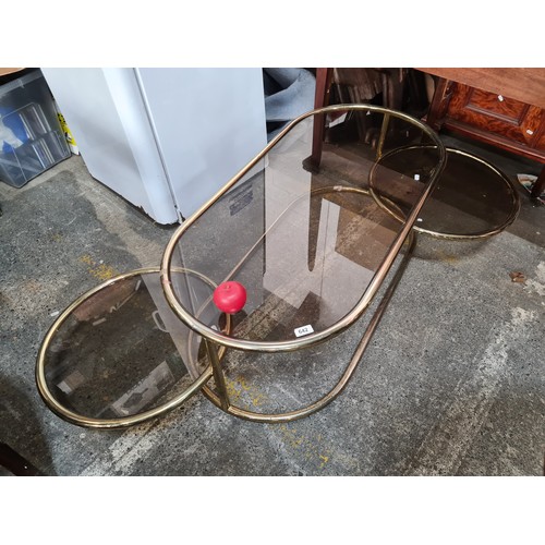 642 - Super Star Lot : A vintage 1960s Italian  signature brass plated oval Sofa table. Features revolving... 