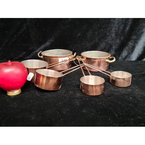 240 - A set of six  copper and brass vintage kitchen measures.