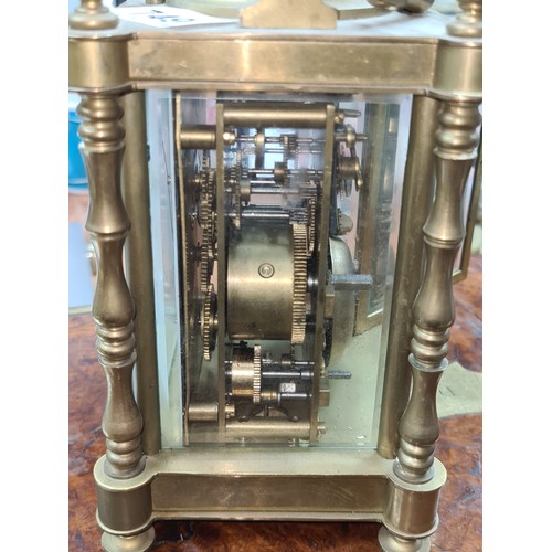 749 - Star lot: An early 20th century hour repeating  brass carriage clock with open glass display showcas... 