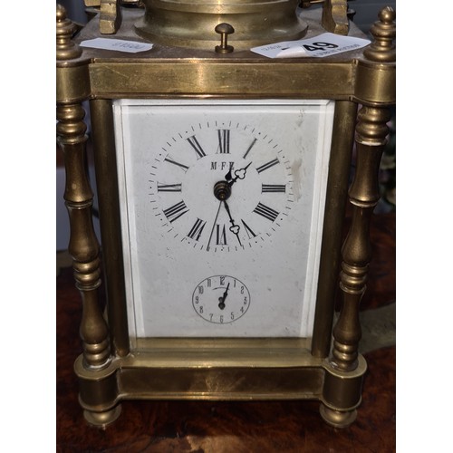 749 - Star lot: An early 20th century hour repeating  brass carriage clock with open glass display showcas... 