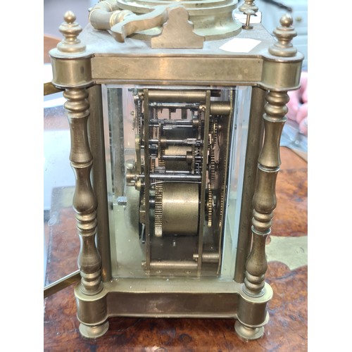 749 - Star lot: An early 20th century hour repeating  brass carriage clock with open glass display showcas... 