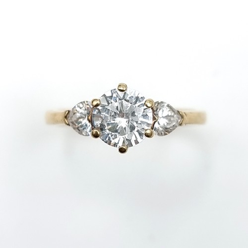 578 - A nine carat gold three stone cubic Zirconia stone ring. Ring size - O. Weight - 2.45 grams. Boxed.