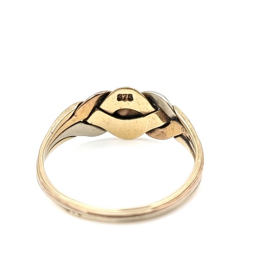 579 - A tri-colour nine carat gold twist set knot ring. Size - V. Weight - 2.89 grams. Boxed.