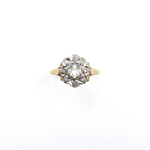 582 - Star Lot : A diamond and aquamarine stone cluster ring set in nine carat gold. Size - L. Weight - 1.... 