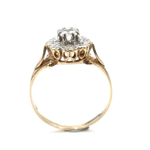 582 - Star Lot : A diamond and aquamarine stone cluster ring set in nine carat gold. Size - L. Weight - 1.... 