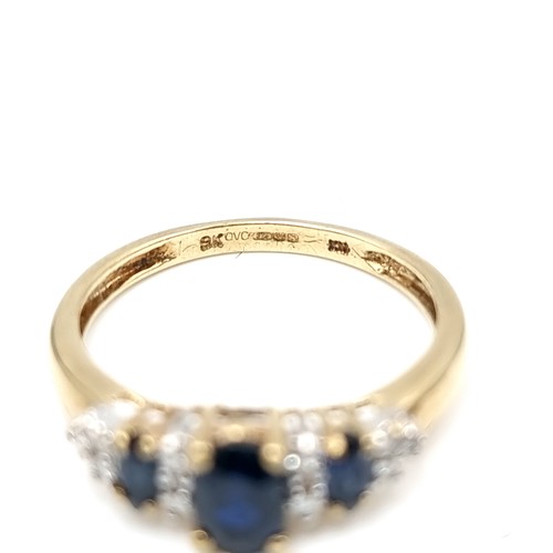 584 - Super Star Lot : A nice example of a diamond and sapphire stone ring set in nine carat gold. Ring si... 