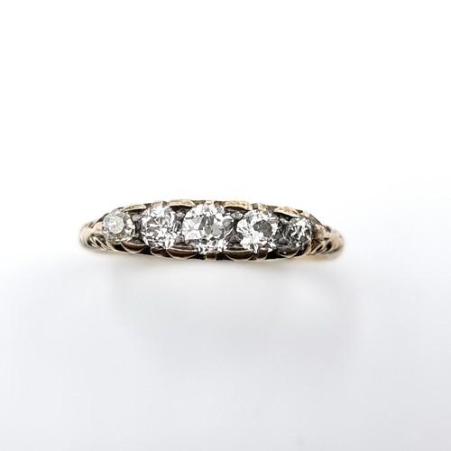 586 - Star Lot : A pretty vintage five stone diamond ring set in 18 carat gold. Est. weight of diamonds is... 