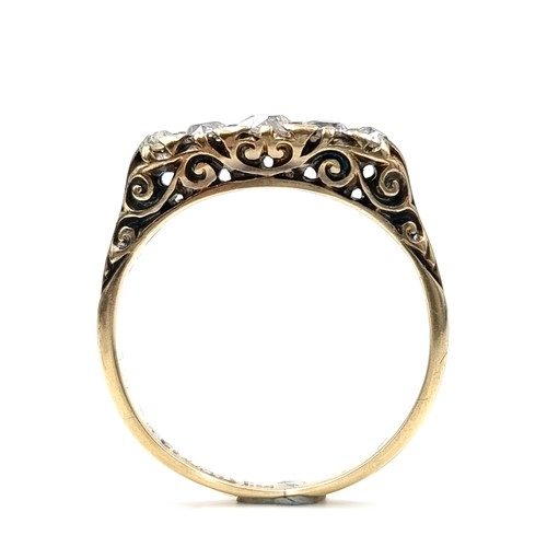 586 - Star Lot : A pretty vintage five stone diamond ring set in 18 carat gold. Est. weight of diamonds is... 