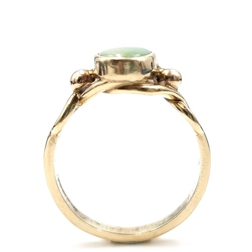 587 - Star Lot : A lovely heavy antique 9 carat gold green tourmaline stone ring with attractive twist mou... 