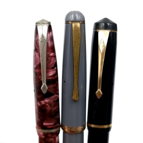 592 - A collection of three pens - A Swan example with 14 carat gold nib together with a Mont Blanc pen wi... 