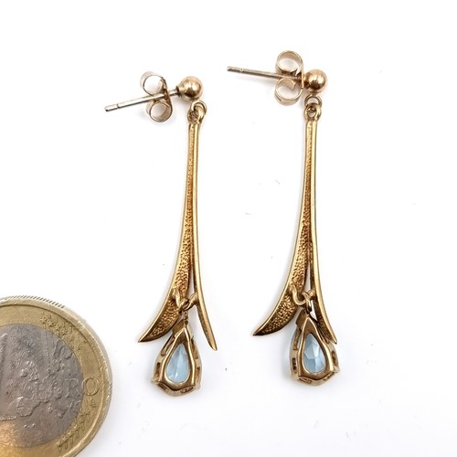 594 - Star Lot : A pretty pair of nine carat gold aquamarine drop earrings. Drop length - 4 cms. Total wei... 