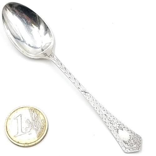 597 - Four vintage sterling silver teaspoons with bright cut handles hallmarked Sheffield. Weight - 41 gra... 