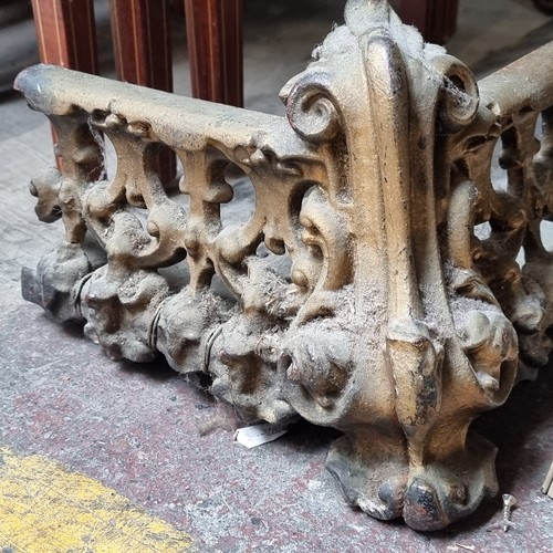 682 - A heavy early 20th century heavy pierced fire fender. Features pierced scroll detail and claw feet
M... 