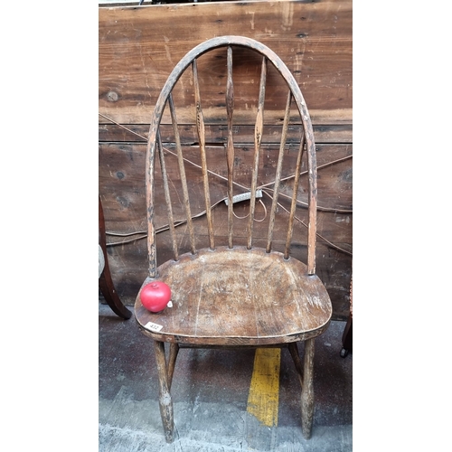 432 - Star Lot : Windsor chair in solid oak, from the late 18th early 19th century. Features a rounded top... 