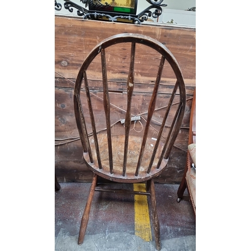 432 - Star Lot : Windsor chair in solid oak, from the late 18th early 19th century. Features a rounded top... 