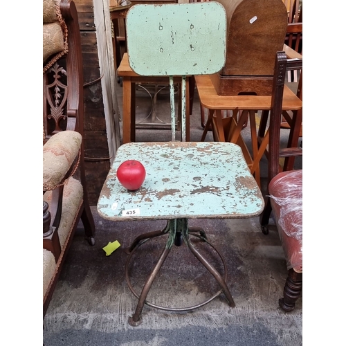 435 - Star Lot : A Vintage industrial metal swivel machinists chair with distressed green paint from the e... 