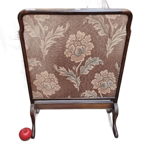 437 - Antique wooden fire screen with floral tapestry insert, featuring a mahogany frame and curved legs, ... 