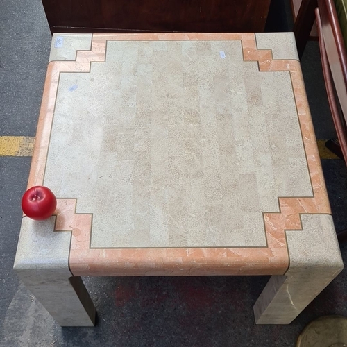 445 - Cream and peach marble coffee table with geometric detailing, Art Deco style. Marble cold to the tou... 