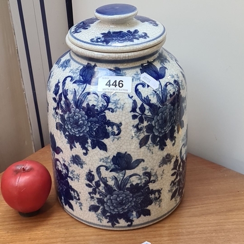 446 - A large Blue and white Victoriana ceramic jar with floral design, featuring a removable lid and trad... 