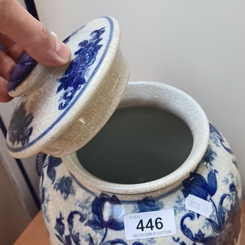 446 - A large Blue and white Victoriana ceramic jar with floral design, featuring a removable lid and trad... 