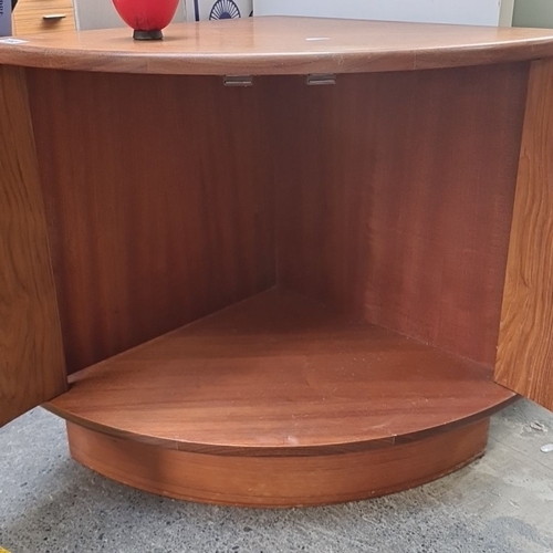 448 - A G Plan Mid-Century Modern corner cabinet in teak, featuring two curved wooden handles and spacious... 