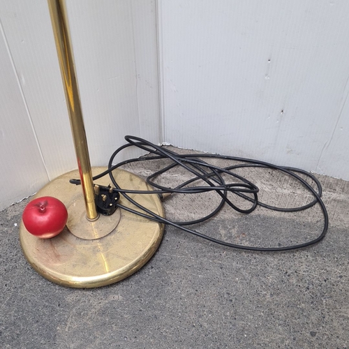 451 - Brass floor lamp, in the Edwardian style with an adjustable arm and electric fitting. It features cl... 