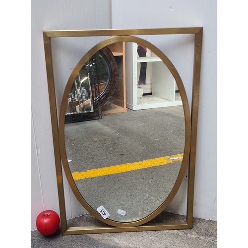 455 - Decorative as new mirror with a gold-effect finished frame, featuring a contemporary oval shape with... 