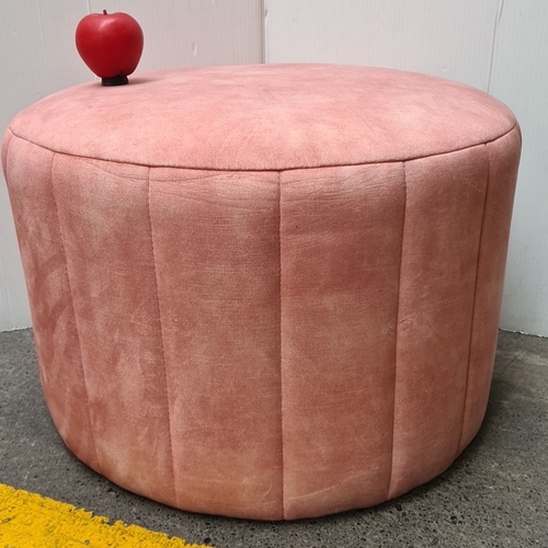 457 - Pink round ottoman with plush velvet upholstery. Nice decorative, functional piece of furniture.