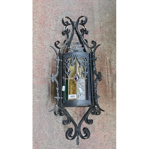 465 - Star Lot : A large vintage Wrought iron lantern with colorful stained glass panels and intricate scr... 