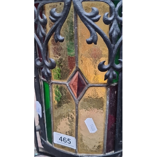 465 - Star Lot : A large vintage Wrought iron lantern with colorful stained glass panels and intricate scr... 