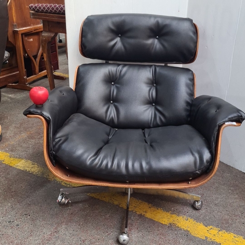 468 - Star Lot : A fabulous Mid-Century Modern Eames-style lounge chair. Black leather upholstery with ros... 