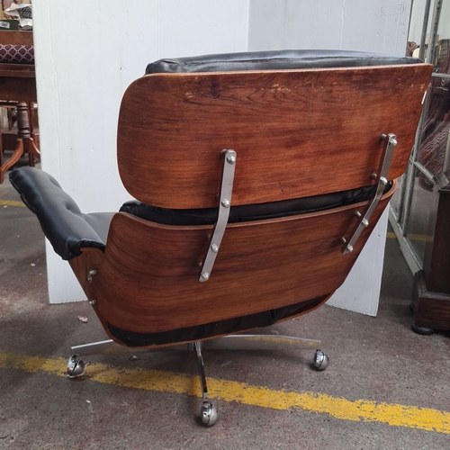 468 - Star Lot : A fabulous Mid-Century Modern Eames-style lounge chair. Black leather upholstery with ros... 