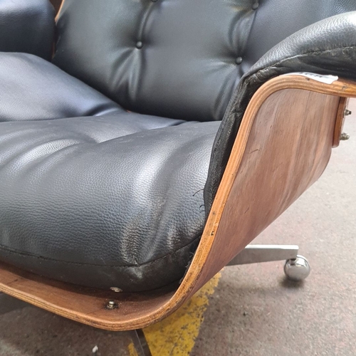 468 - Star Lot : A fabulous Mid-Century Modern Eames-style lounge chair. Black leather upholstery with ros... 