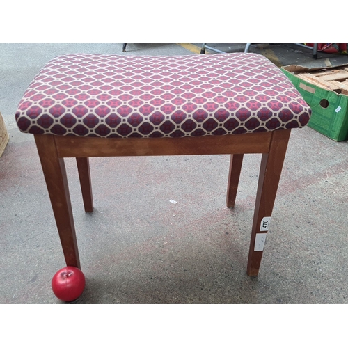 470 - Wooden stool with a patterned fabric seat. Could be a piano stool