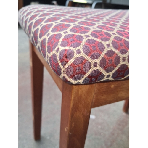 470 - Wooden stool with a patterned fabric seat. Could be a piano stool