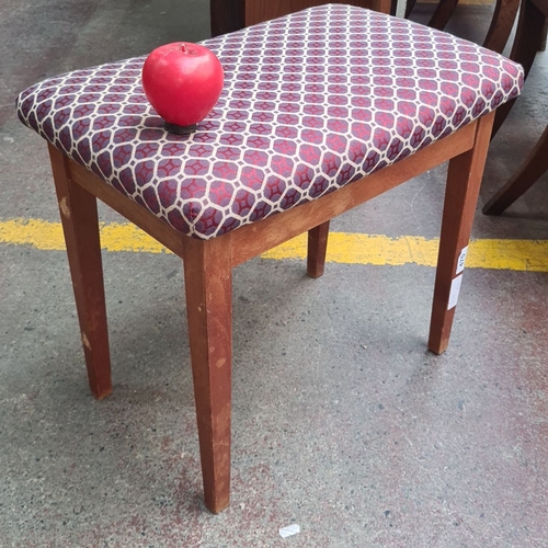 470 - Wooden stool with a patterned fabric seat. Could be a piano stool