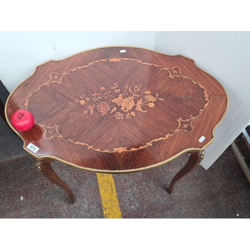 473 - Star Lot : A stunning Italian  inlaid mahogany occasional table with floral marquetry and ormolu mou... 