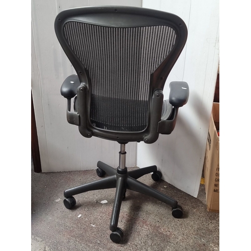 479 - Star Lot : A super Herman Miller Aeron B office chair in black mesh features adjustable armrests and... 