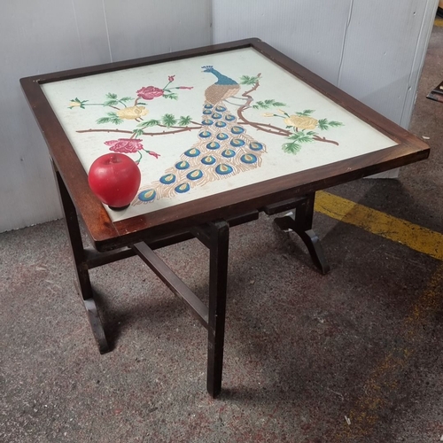 485 - Mahogany fire screen with pop up table with embroidered peacock and floral design on top.