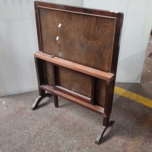 485 - Mahogany fire screen with pop up table with embroidered peacock and floral design on top.