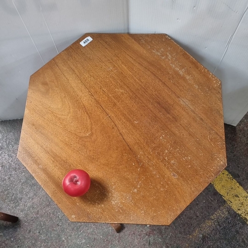 488 - Octagonal wooden pop up side table with pedestal base and curved supports, from the mid-20th century... 